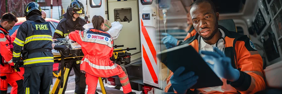 emergency services loading ambulance and emergency services frontline worker using tablet